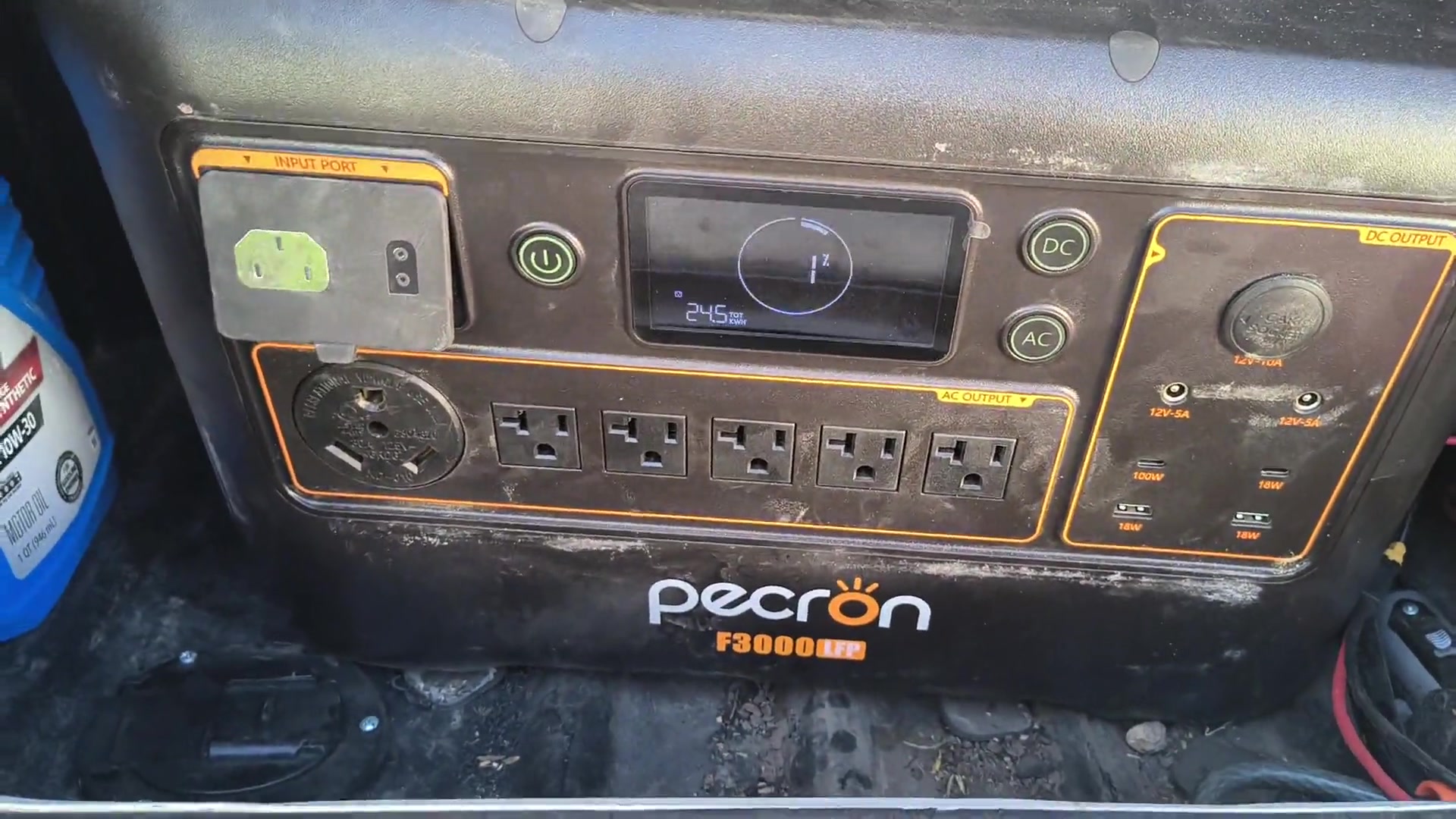 Pecron F3000 LFP portable power station in the Compass AWD storage bay, front panel and display visible