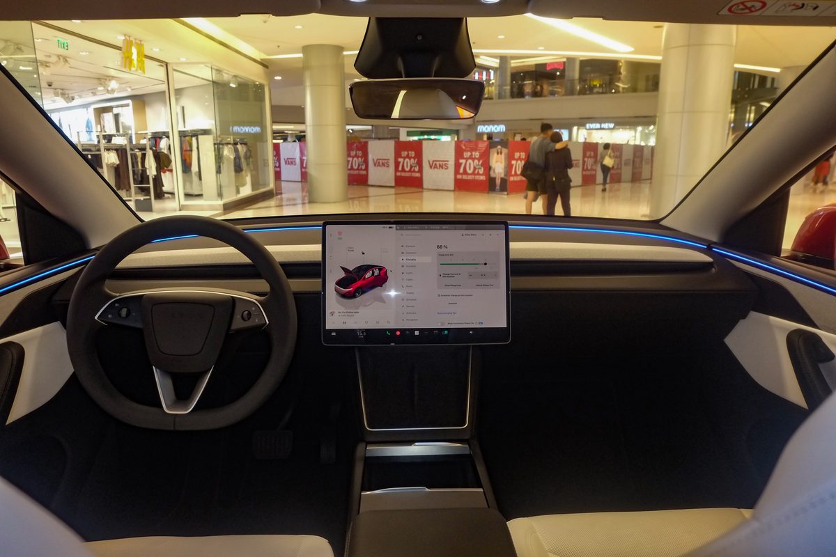 White and black interior of a Tesla Model Y Juniper Long Range AWD.